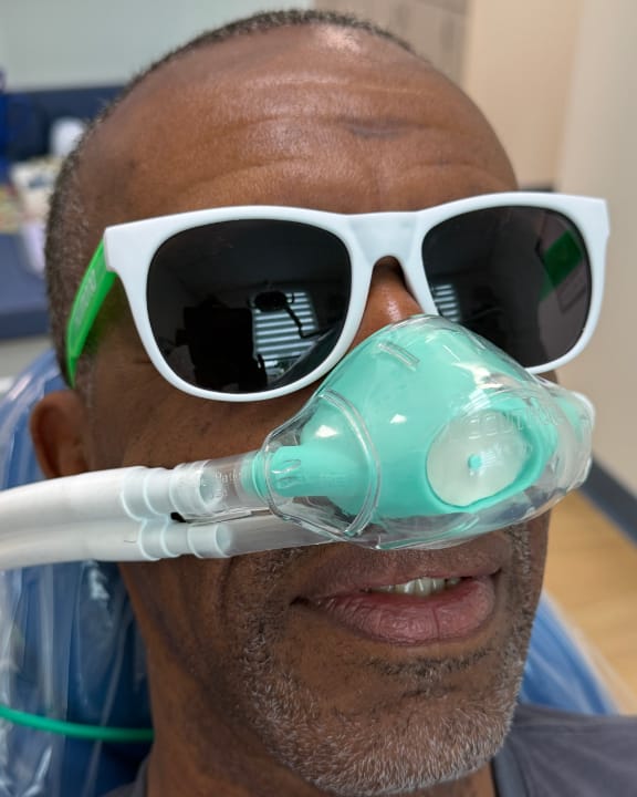 A relaxed patient receiving comfortable sedation dentistry at Tomlinson Dental in Tampa