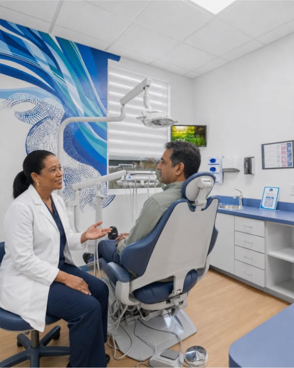A patient discussing an upcoming procedure with a dentist