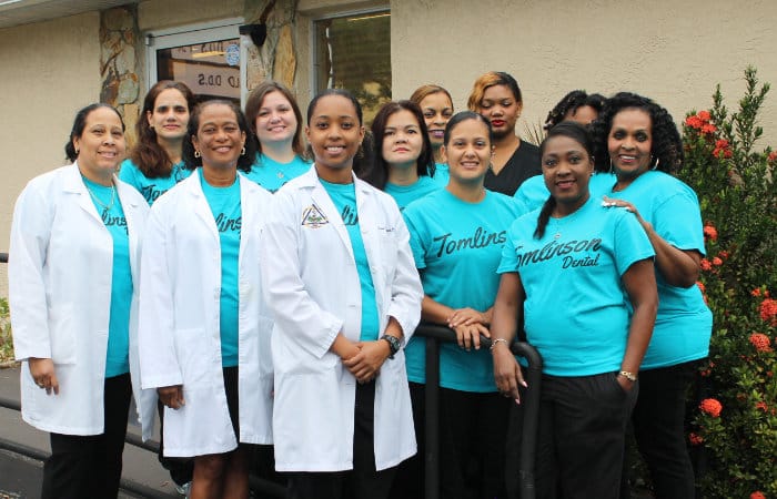 Group Clinic picture. Everyone is wearing bright turquoise shirts.