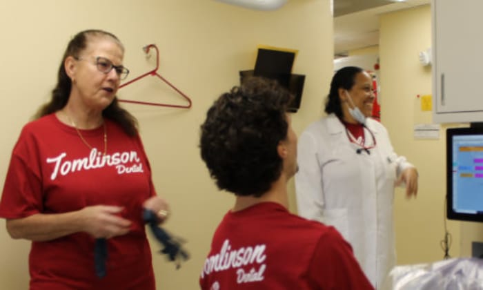 Three Tomlinson Dental Associates posing for a picture inside the clinic.